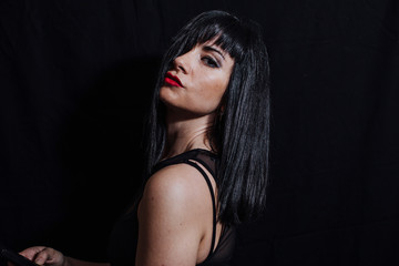 Fototapeta na wymiar woman posing on black background