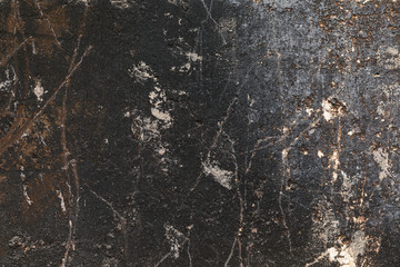 Texture of the old wall with burnt plaster. Abstract background