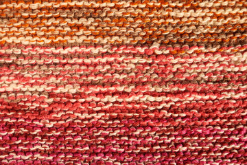 Fototapeta premium Multicolored knitted texture in macro using shawl technique