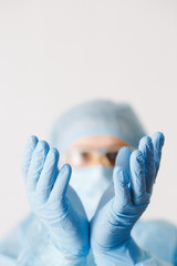 Close up of doctor hand holding. Mock up. Medical equipment. A doctor wearing personal protective equipment including mask, goggle, and suit to protect COVID 19 coronavirus infection.