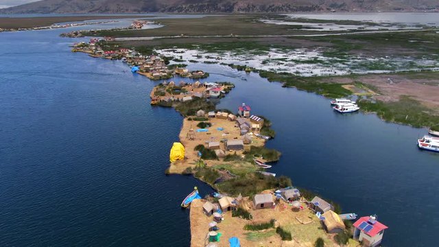 Aerial view of Uros Floating Islands (Spanish: Islas Uros ) on Lake Titicaca, the highest navigable lake in the world, near Puno, Peru, South America.
