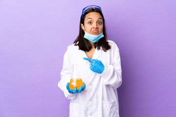 Scientist woman investigating a vaccine to cure coronavirus disease pointing to the laterals having...