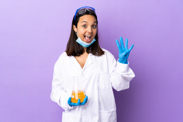 Scientist woman investigating a vaccine to cure coronavirus disease happy and counting four with fingers