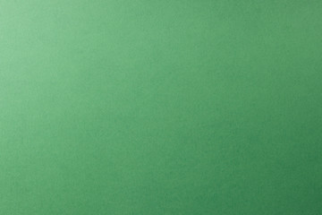green paper background, copy space, texture.