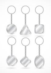 Realistic key holders set, vector medal templates hanging on chain with holding ring. Silver mock up for company branding, souvenirs with copy space for symbol or logo and various pendant shapes.