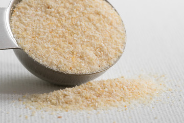 Onion Powder Spilled from a Teaspoon