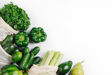 Organic vegetables and fresh green in reusable produce bags. Sustainable lifestyle. Plastic free concept. Flat lay, top view