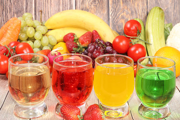 Citrus cider, juice, drinks and ingredients on a wooden table. The concept of detox diet and weight loss, healthy and natural foods. Summer drinks, vitamins C,