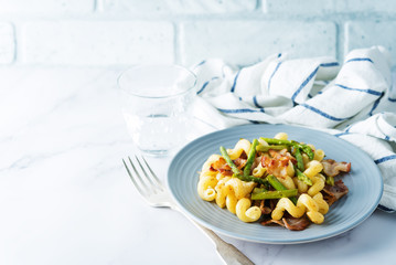 Fried Bacon roasted asparagus pasta in a plate