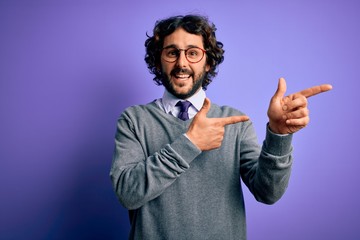 Handsome businessman with beard wearing tie and glasses standing over purple background smiling and looking at the camera pointing with two hands and fingers to the side.