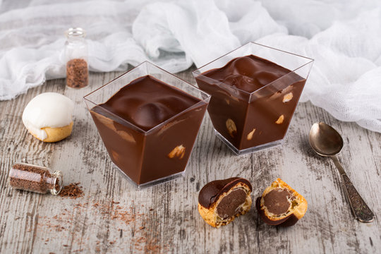 Profitroli in chocolate mousse with chocolate cream