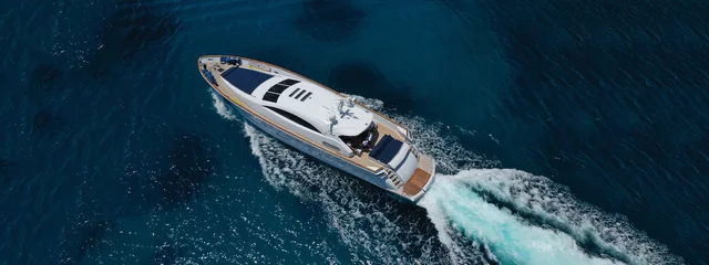 Foto op Canvas Aerial drone top down photo of luxury yacht with wooden deck anchored in open ocean sea © aerial-drone