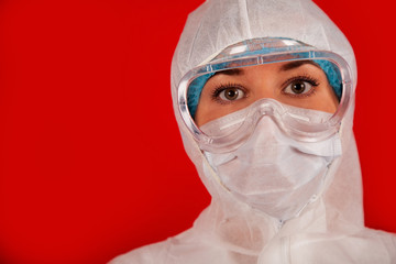 Doctor woman in a protective suit against coronavirus. Medical staff, preventive equipment