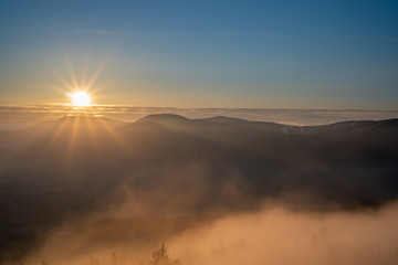 sunrise in mountains with fog and beautiful clear sky, czech Beskydy, Velky Javornik
