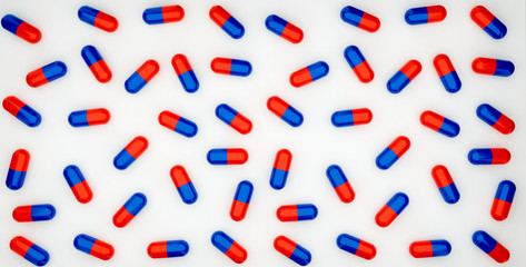 Pattern capsule tablets blue and red on white background 3d rendering illustration