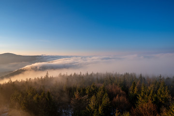 Obraz na płótnie Canvas Beautifully lit fog at sunrise in the mountains, Czech Beskydy