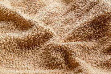 abstract background of beige terry towel close up