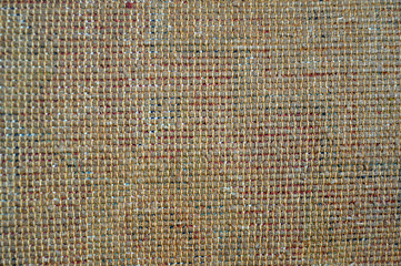 Rear view of an old wool carpet. Texture.