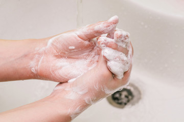 Fototapeta premium Hand washing with soap. Coronavirus epidemic prevention. Influenza Prevention.