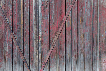 Red wooden boards or fence texture background or backdrop with old paint