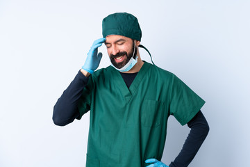 Surgeon man in green uniform over isolated background laughing
