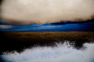 water splash, ocean, sky and clouds