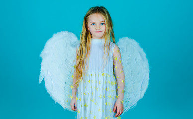 Cute child girl posing with angel wings. Beautiful little angel. Face of beautiful little angel...