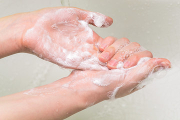 Rubbing hands with soap. Prevention of the disease with coronavirus and other viruses.