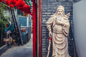 Sculpture on a traditional yard called siheyuan in hutong area of Dongcheng district of Beijing capital city, China