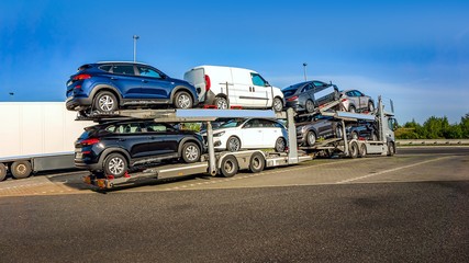 Car carrier on the highway. Freight transport, logistics cargo delivery