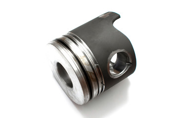 New car engine piston, vehicle motor renovation isolated on white. Spare parts.