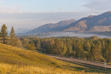 Fototapeta premium View of the Altai mountains. Alpine valley. Peaks in a blue haze.