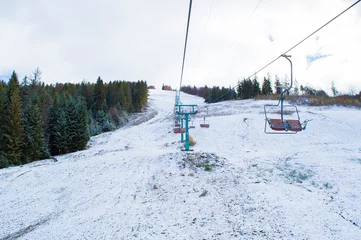Fotobehang chairlift on a background of hills © Serhii  Holdin