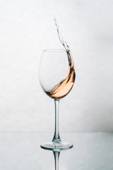 A glass of white wine and apple juice