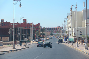 Transportation and traffic on highway in Hurghada city. City with street cars