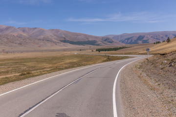 winding roadto Altai Mountains, Altai region, Siberia, Russia.