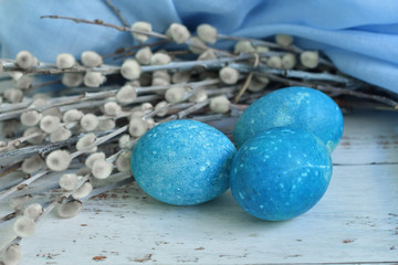 Blue Easter eggs on light background. Naturally Eggs painted with hibiscus and red cabbage with marble stone effect.Eco paint. Happy Easter card