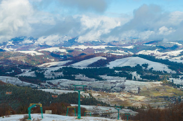 chairlift on a background of hills