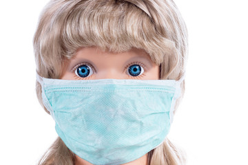 Figurine of girl in a medical mask isolated on white background. Face mask protection against pollution, virus, flu and coronavirus. Health care and surgical concept.