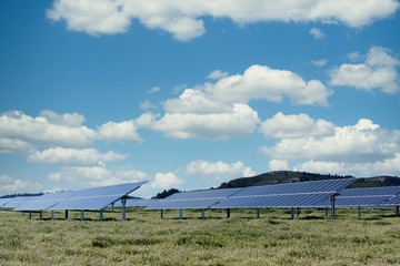 photovoltaic solar power panel on sky background, green clean Alternative power energy concept.