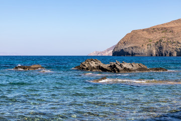 Fototapeta na wymiar Cliffs and mountains in Papafragas beach