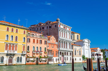 Fototapeta na wymiar The Palazzo Flangini is a Baroque style palace building and Campo San Geremia Roman Catholic church on the Grand Canal waterway with boat in Cannaregio sestiere, Venice, Veneto Region, Northern Italy