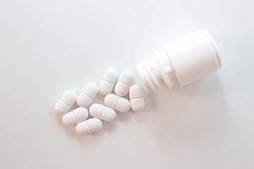 Top view of the pill bottle on white