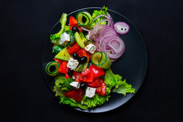 Salad with feta cheese. Top view. Free space for your text.