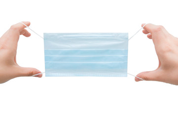 human hands hold a medical breathing mask on a white background. female hands in the frame
