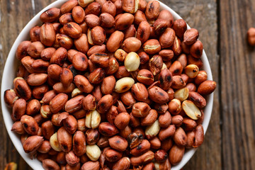 Peanuts in bowl and salt shaker