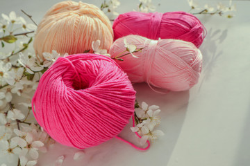 Colorful cotton yarn balls on light background