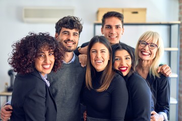 Group of business workers smiling happy and confident. Posing together with smile on face looking at the camera at the office