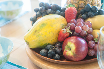 Obraz na płótnie Canvas Tropical Fruits Basket, Pineapple, Papaya, Apple, Grape, strawberry, 