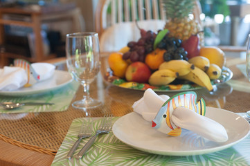 Table setting, white napkin with fish napkin ring